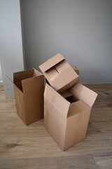 Several rectangular cardboard boxes stacked on top of each other.