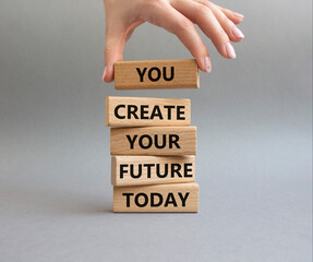 Future and development symbol. Wooden blocks with words You Create your Future today. Businessman...