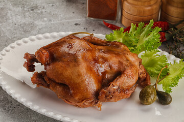 Baked small chicken with spices