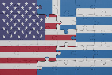 puzzle with the colourful national flag of greece and flag of united states of america .