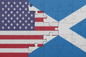 puzzle with the colourful national flag of scotland and flag of united states of america .