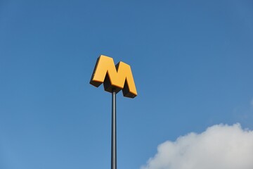 Metro station sign up in the air