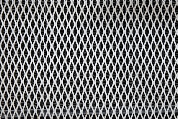Metal textured grid with rhombus holes background. Grey metallic diamond-shaped surface of car radiator.