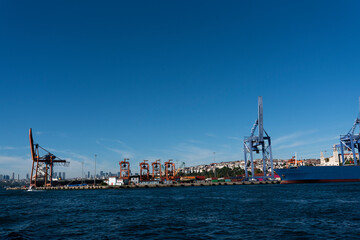 Fototapeta premium commercial shipping port. commercial ships loading and unloading in the port
