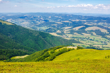 carpathian mountain landscape of ukraine in summer. rural valley of podobovets village view from the top. popular nature tourism destination on a sunny day