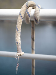 Clove hitch tied to ensure an attachment between line and objects, providing stability and security for sailing enthusiasts during boat trips and mooring operations, a testament to nautical expertise.