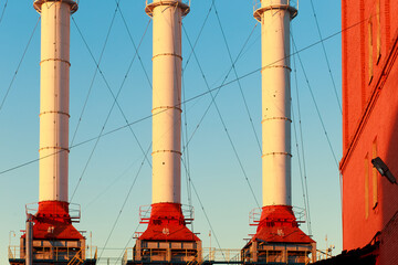 Chimneys of the power plant against the sky.