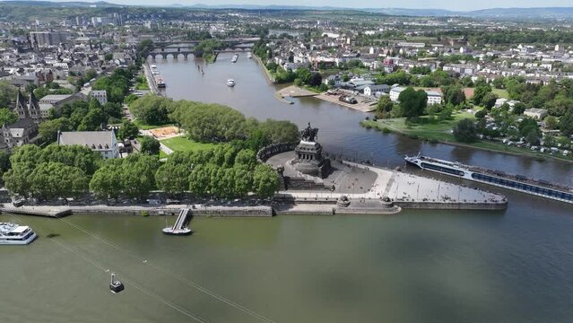 Aerial hyperlapse of the The Deutsches Eck in Koblenz, Germany, where the Mosel river joins the Rhine river.