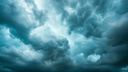 Obraz premium Blue and grey stormy sky with bright white clouds