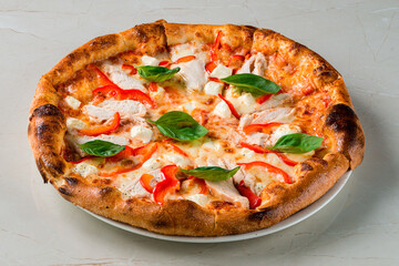 A classic pizza topped with tomato sauce and cheese, placed on a rustic wooden table