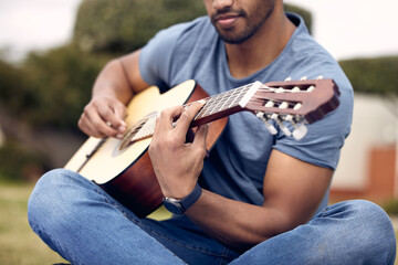 Man, hands and guitar in garden for music, sound and performance in nature. Male person, musician...