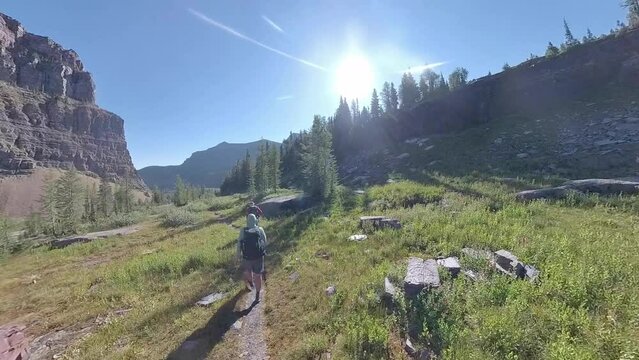 Men Hiking Toward Boulder Pass in Glacier National Park