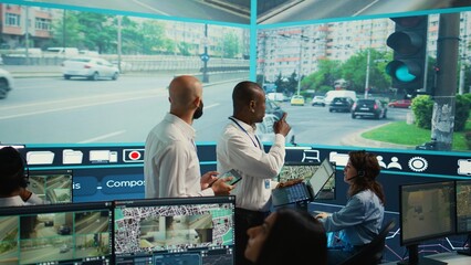 Experts monitoring real time urban traffic dynamics with help from surveillance footage and CCTV...