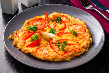 Plate of food with tomatoes and peppers  a delicious and colorful dish