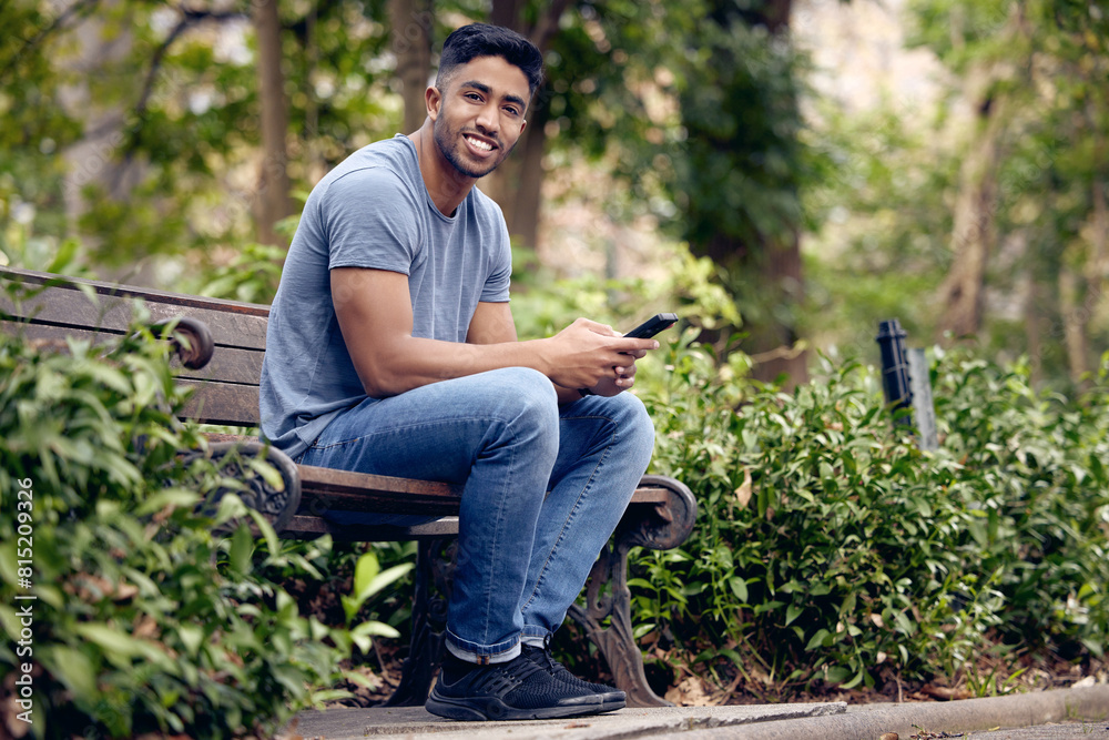 Poster Phone, man and student in park, smile and typing in app with connection to social media and chat. University, education and person in campus with mobile, texting and check for update in studying