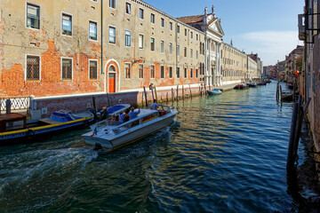 Grand Canal, Venice with View of the river and city historical architecture. with gondolas in...