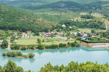 Fototapeta premium Village near lake Komoni in the countryside of North Albania