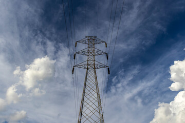 High voltage towers against blue sky background in Brazil
