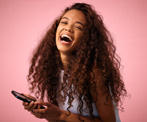 Happy woman, portrait and laughing with phone for funny meme, joke or social media on a studio...