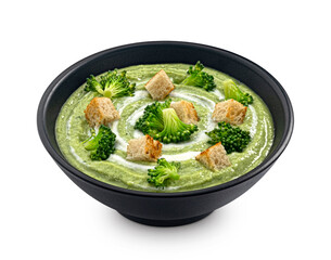 Broccoli cream soup with croutons isolated on white background