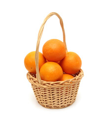 Nice fresh orange isolated in basket on a white background