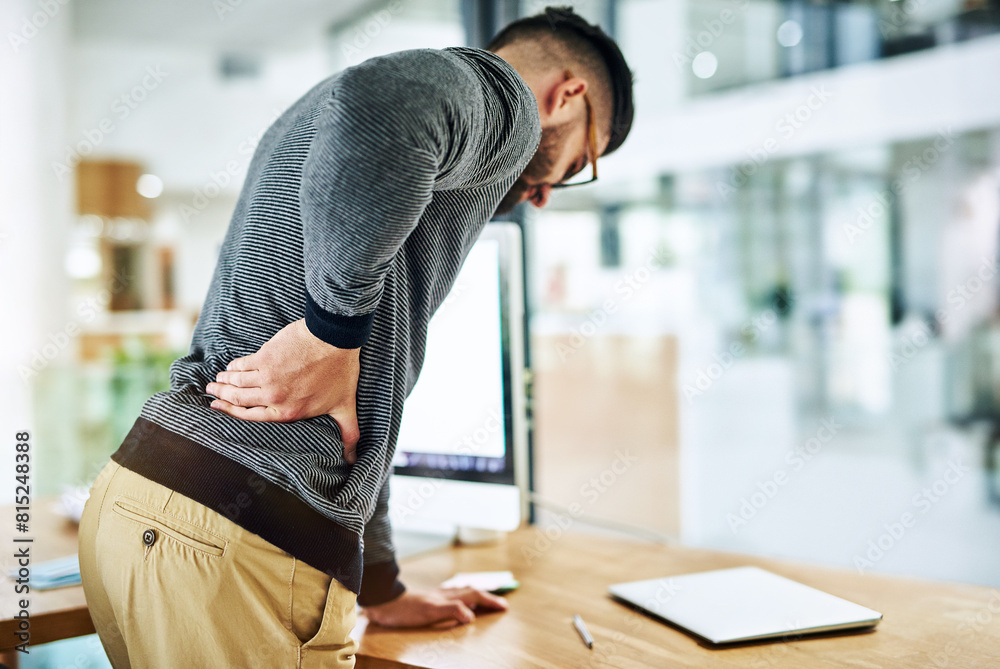 Aufkleber Back pain, business man and social media worker with strain, stress and anxiety by a computer in office. Tech, web and working with online, digital and internet project with work problem at company