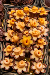 Delicious handmade and traditional chocolates decorated with fruit flavors, delicious sweet cocoa delights with different decorations