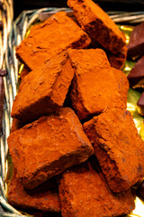 Delicious handmade and traditional chocolates decorated with fruit flavors, delicious sweet cocoa delights with different decorations