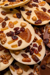 Delicious handmade and traditional chocolates decorated with fruit flavors, delicious sweet cocoa delights with different decorations