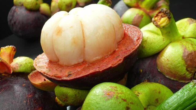 Mangosteen, A tropical delight with a regal reputation. Sweet, tangy, and juicy, encased in a thick purple rind. Its antioxidant prowess earns it the title "queen of fruits."
