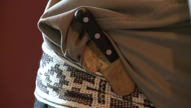An Argentine Gaucho Carrying a Traditional Facon Knife on his Belt. Close Up.