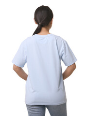 Woman wearing light blue t-shirt on white background, back view
