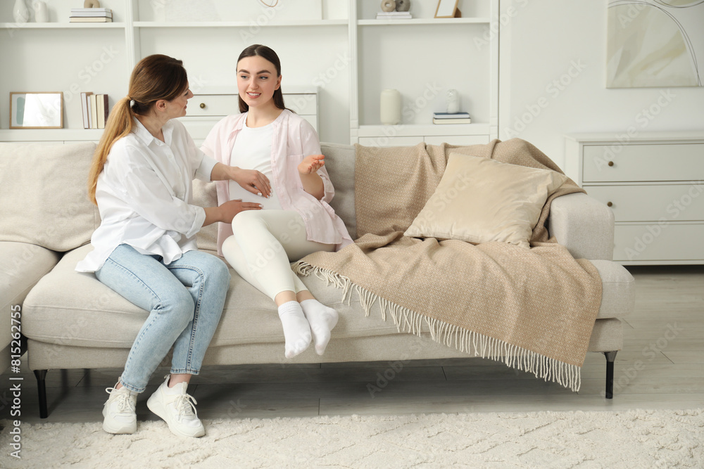 Sticker Doula taking care of pregnant woman on sofa at home. Preparation for child birth