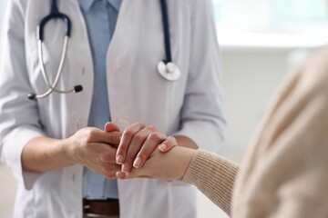 Professional doctor working with patient in hospital, closeup