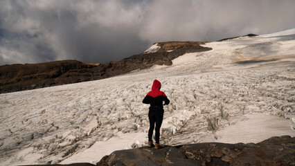 Nature immensity. Extreme. View of a hiker silhouette contemplating the vast Castaño Overo glacier...