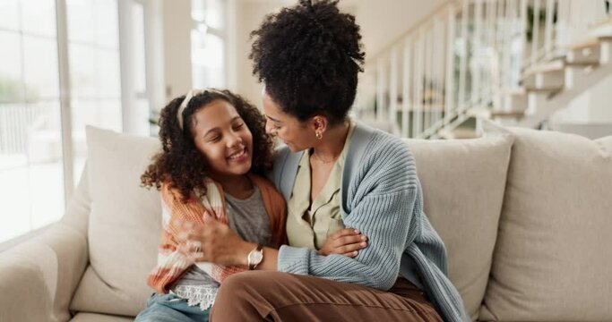 Home, hug and mothers with girl on couch, love and bonding together with happiness, relax and smile. Apartment, single parent and mama with daughter, kid and embrace with comfort, support and family