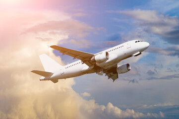 Obraz premium Travel background with airplane flying in the blue sky