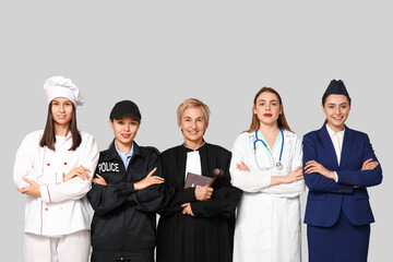 Women of different professions on grey background