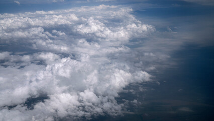 Obraz premium Cloudscape. View of the clouds and earth seen from a plane