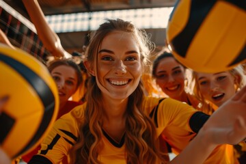Blonde female volleyball players exhibit teamwork and joy as they work together to defend and set the ball during the game on the volleyball court.