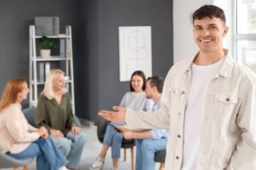 Fototapeta premium Young man at group therapy session