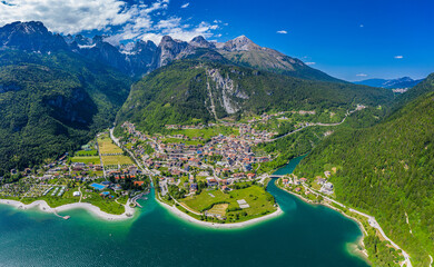 Panoramic Aerial View of Lago di Molveno, Vibrant Alpine Lake Scenery in Trentino, Italy