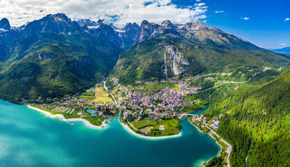 Drone Panoramic View of Molveno Lake Surrounded by Italian Alps and Lush Greenery