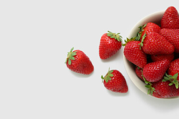 Bowl with sweet fresh strawberries on white background
