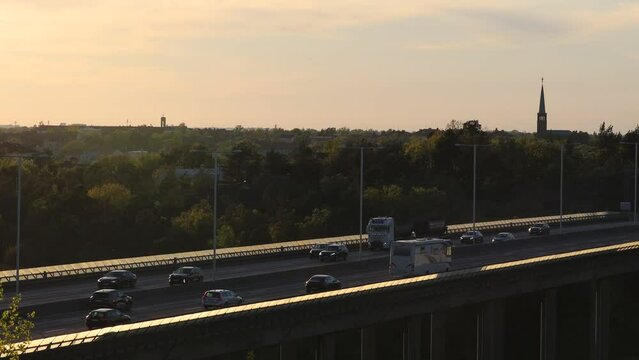 Stockholm, Sweden Traffic at sunset on the Essingeleden and E4 elevated highway in the Grondal district. 