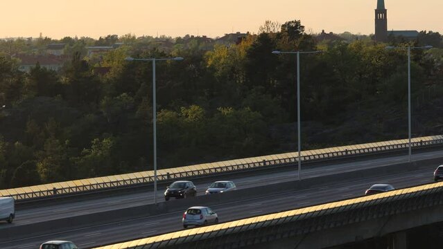 Stockholm, Sweden Traffic at sunset on the Essingeleden and E4 elevated highway in the Grondal district. 