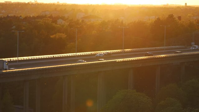 Stockholm, Sweden Traffic at sunset on the Essingeleden and E4 elevated highway in the Grondal district. 