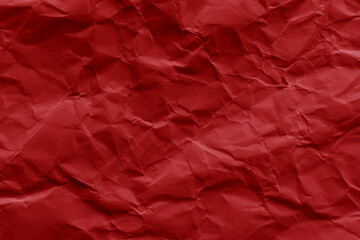 Crumpled red paper texture background. Wrinkled paper surface.