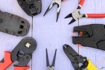 Tools for electrical work during the assembly of equipment. Close-up. Soft focus.