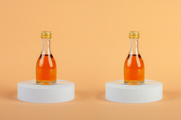 Glass jar with sweet honey isolated on cream background